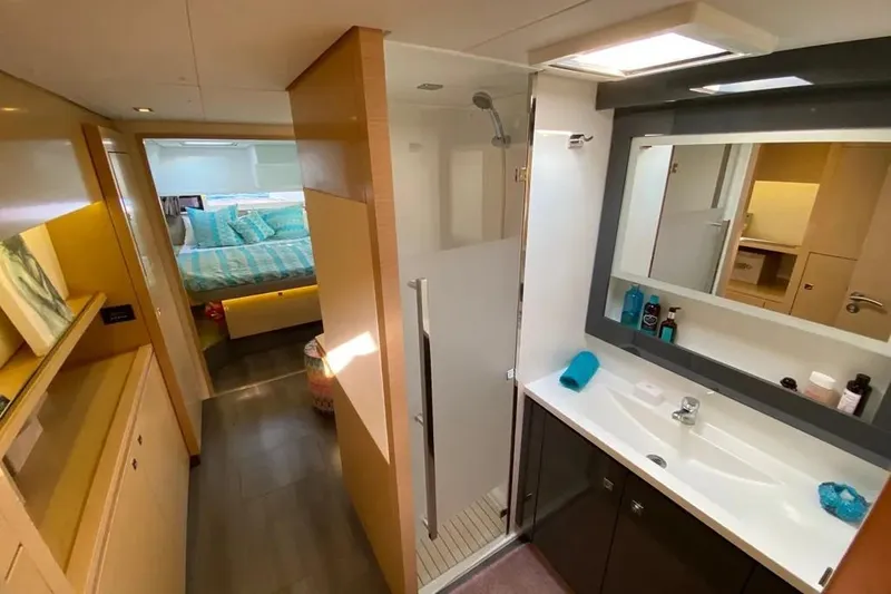 Xclip Yacht Photos Pics Luxurious interior of 2015 Fountaine Pajot SABA 50 yacht with modern bathroom and cozy bedroom.