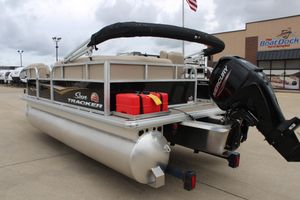 2025 Sun Tracker Party Barge 16 DLX pontoon boat with Mercury outboard motor.