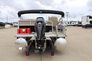 2025 Sun Tracker Party Barge 16 DLX pontoon boat, rear view with motor and fuel tanks.