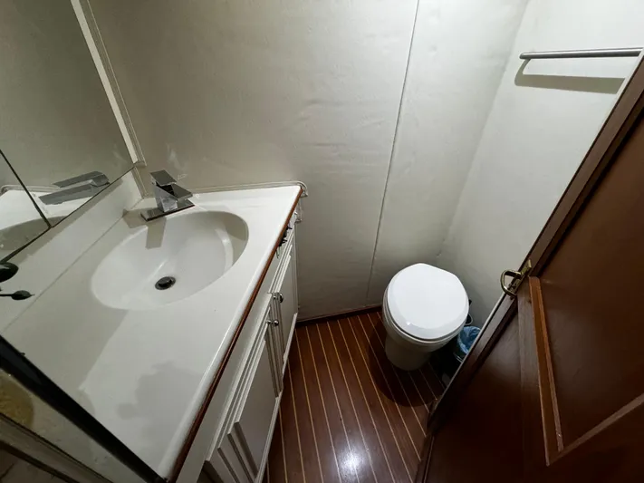 Sweet Melissa Yacht Photos Pics Bathroom interior of 1992 Ocean Yachts 48 Convertible with sink and toilet.