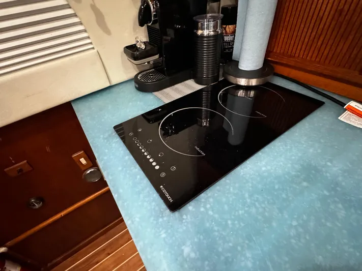 Sweet Melissa Yacht Photos Pics Induction cooktop on Ocean Yachts 48 Convertible, 1992 model, with blue countertop.