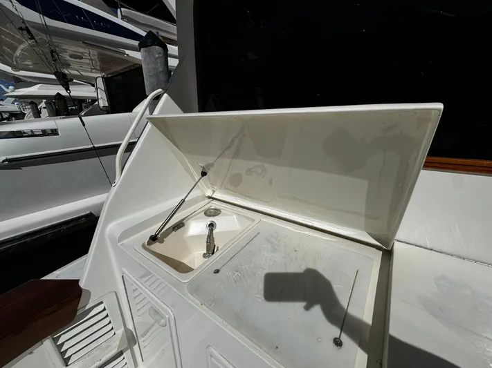 Sweet Melissa Yacht Photos Pics 1992 Ocean Yachts 48 Convertible yacht sink area with open lid.