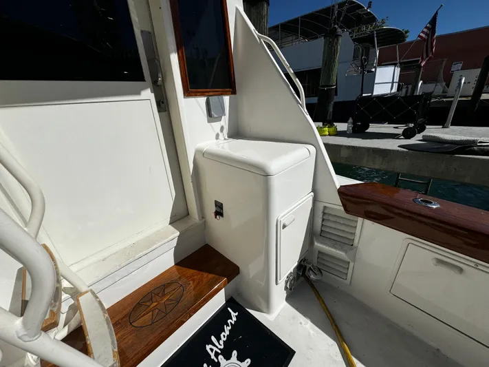 Sweet Melissa Yacht Photos Pics Ocean Yachts 48 Convertible 1992 boat deck with steps and storage compartment.