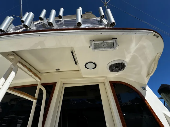 Sweet Melissa Yacht Photos Pics 1992 Ocean Yachts 48 Convertible boat deck with rod holders and ladder.