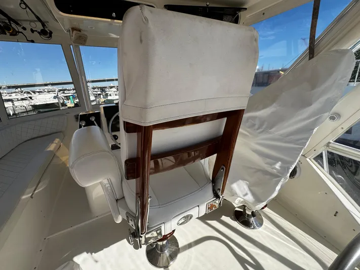 Sweet Melissa Yacht Photos Pics Interior of 1992 Ocean Yachts 48 Convertible, featuring captain's chair and helm station.