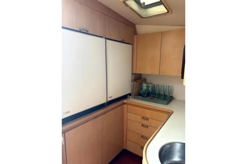  Yacht Photos Pics 1993 Tiara Yachts 43 Open galley with wood cabinets and dual refrigerators.