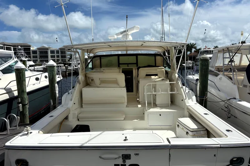  Yacht Photos Pics 1993 Tiara Yachts 43 Open docked at marina, showcasing spacious deck and seating area.