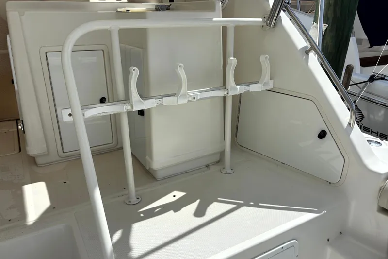  Yacht Photos Pics 1993 Tiara Yachts 43 Open cockpit with rod holders and storage compartments.