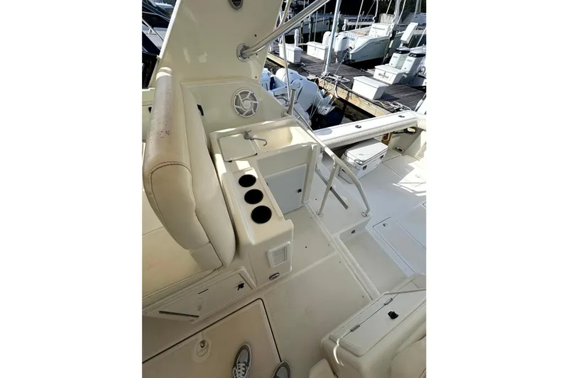  Yacht Photos Pics 1993 Tiara Yachts 43 Open interior with seating and cup holders, docked at marina.