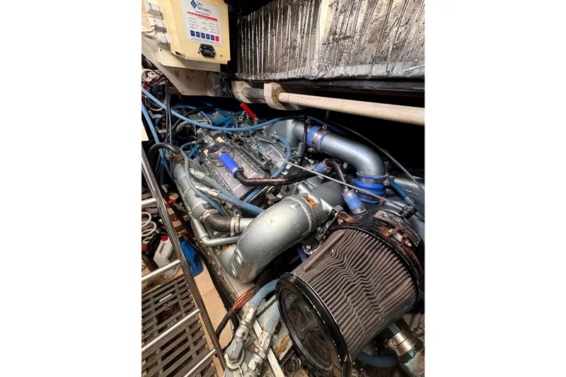  Yacht Photos Pics Engine room of 1993 Tiara Yachts 43 Open, showcasing complex machinery and components.