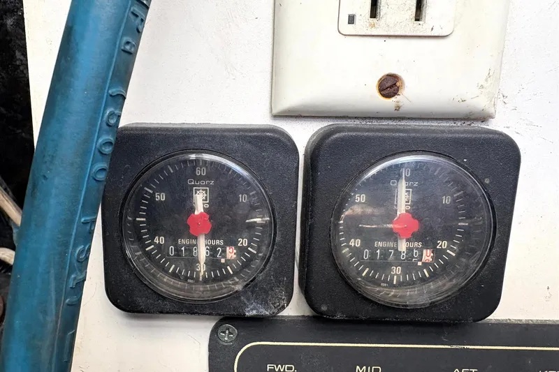  Yacht Photos Pics Engine hour meters on a 1993 Tiara Yachts 43 Open dashboard, showing usage hours.