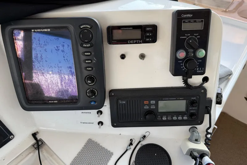  Yacht Photos Pics Control panel of a 2000 Novatec Cockpit Motor Yacht with navigation and communication equipment.