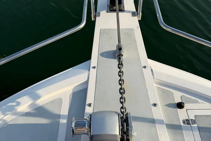  Yacht Photos Pics Bow of 2000 Novatec Cockpit Motor Yacht with anchor chain and railing.