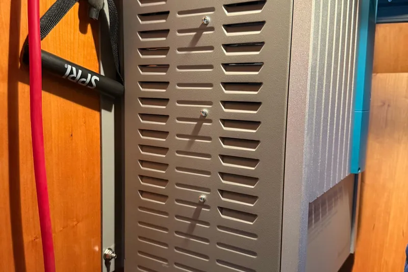  Yacht Photos Pics Ventilated panel inside a 2000 Novatec Cockpit Motor Yacht, featuring red and black cables.