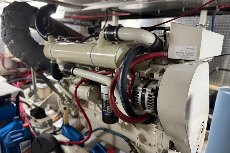  Yacht Photos Pics Engine room of a 2000 Novatec Cockpit Motor Yacht, showcasing detailed machinery components.