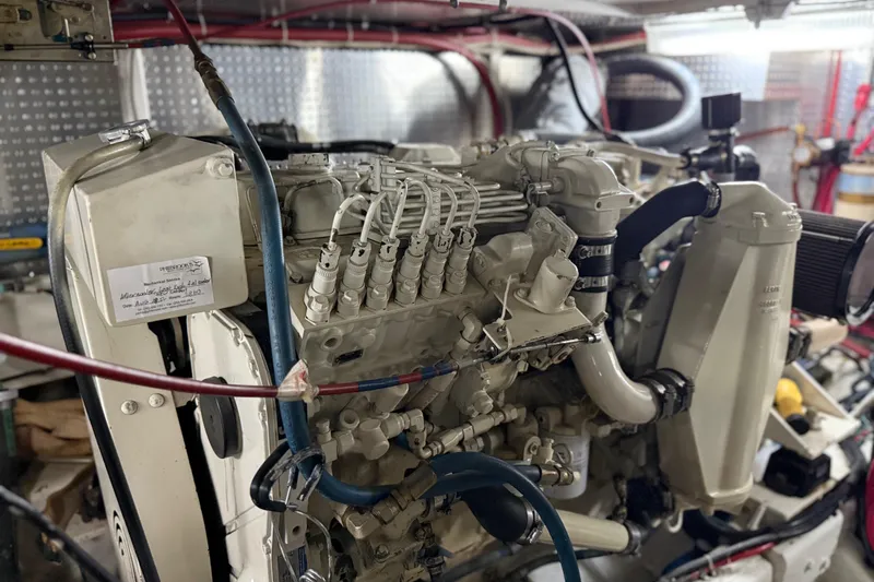  Yacht Photos Pics Engine room of a 2000 Novatec Cockpit Motor Yacht, showcasing detailed machinery.