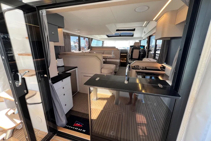  Yacht Photos Pics Luxurious interior of 2025 Nimbus 495 Flybridge yacht with modern furnishings and sleek design.