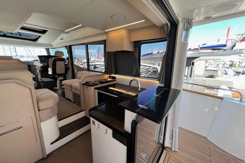  Yacht Photos Pics Luxurious interior of 2025 Nimbus 495 Flybridge yacht with modern amenities and sleek design.