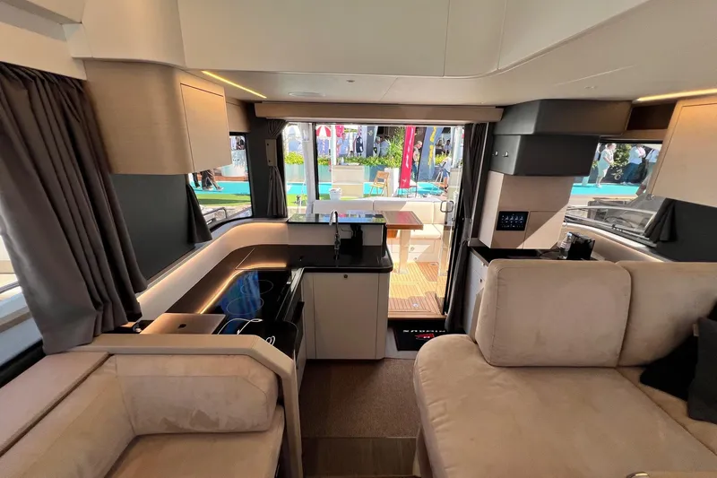 Yacht Photos Pics Luxurious interior of 2025 Nimbus 495 Flybridge yacht, featuring modern design and comfortable seating.