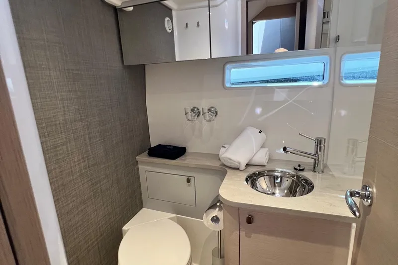  Yacht Photos Pics Luxurious bathroom in 2025 Nimbus 495 Flybridge yacht with modern fixtures and elegant design.