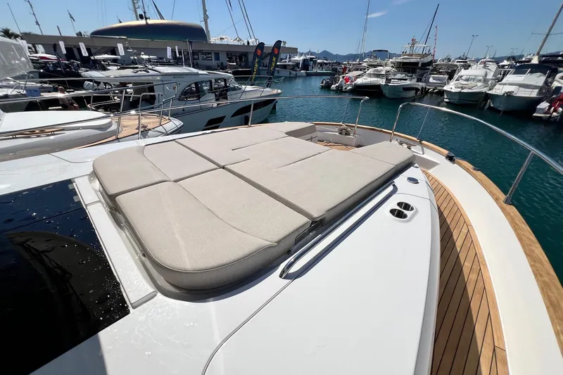  Yacht Photos Pics Luxurious 2025 Nimbus 495 Flybridge yacht with spacious sunbathing deck at marina.