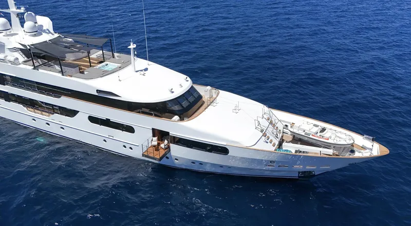 Magna Grecia Yacht Photos Pics Luxurious 1986 Custom Elsflether Werft yacht cruising on open blue sea.