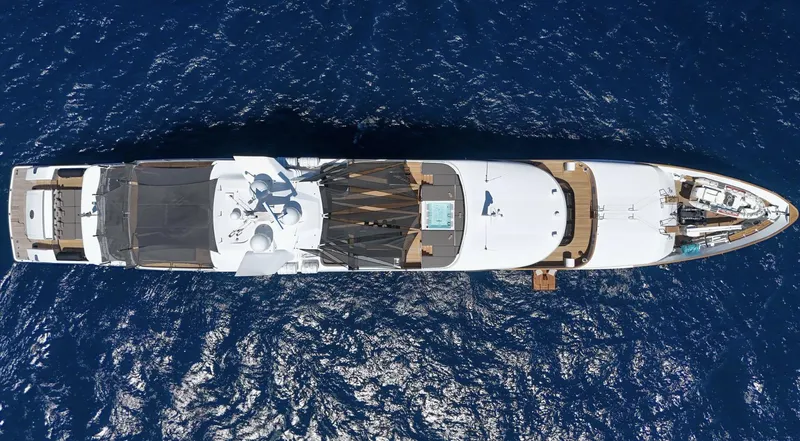 Magna Grecia Yacht Photos Pics Aerial view of 1986 Custom Elsflether Werft yacht on deep blue ocean.