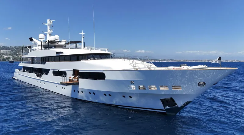 Magna Grecia Yacht Photos Pics Luxurious 1986 Custom Elsflether Werft yacht cruising on clear blue waters.