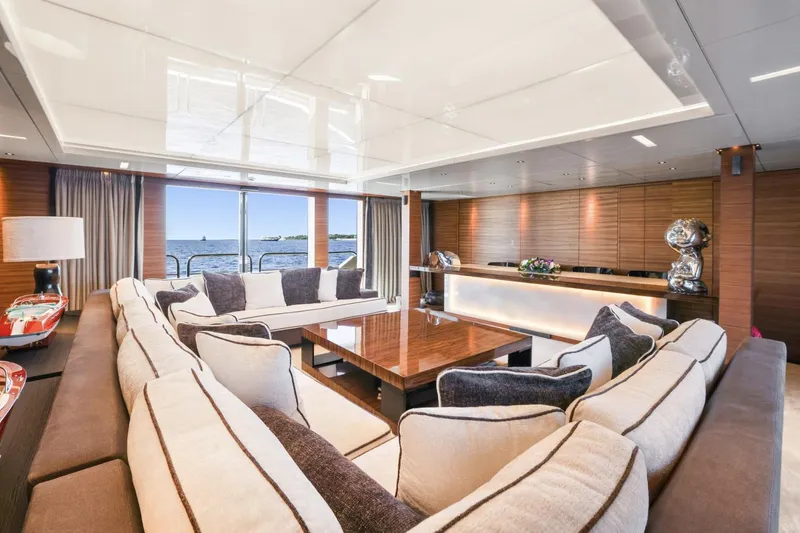 Magna Grecia Yacht Photos Pics Luxurious yacht interior with elegant seating, wooden accents, and ocean view, 1986 Elsflether Werft.