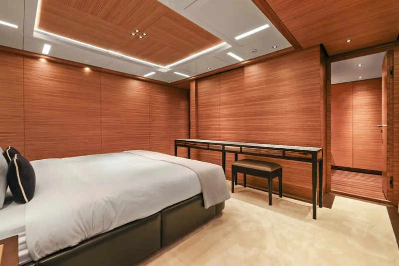 Magna Grecia Yacht Photos Pics Luxurious yacht bedroom with wood paneling, modern design, and elegant furnishings, Elsflether Werft 1986.