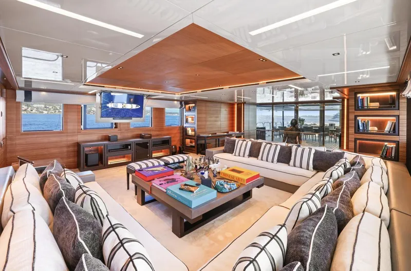 Magna Grecia Yacht Photos Pics Luxurious yacht interior with plush seating, modern decor, and ocean views, Elsflether Werft 1986.