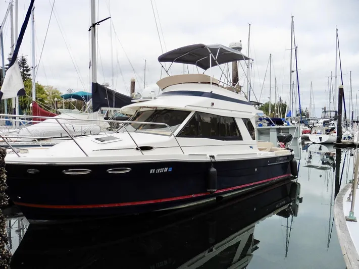 Yacht Photos Pics 2015 Cutwater 30CB yacht docked in marina, surrounded by sailboats.