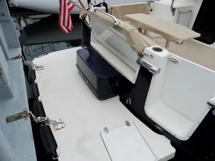  Yacht Photos Pics 2015 Cutwater 30CB boat deck with seating and American flag.