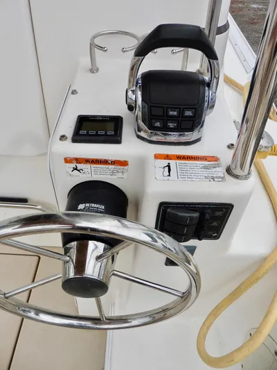  Yacht Photos Pics 2015 Cutwater 30CB boat helm with steering wheel and control panel.