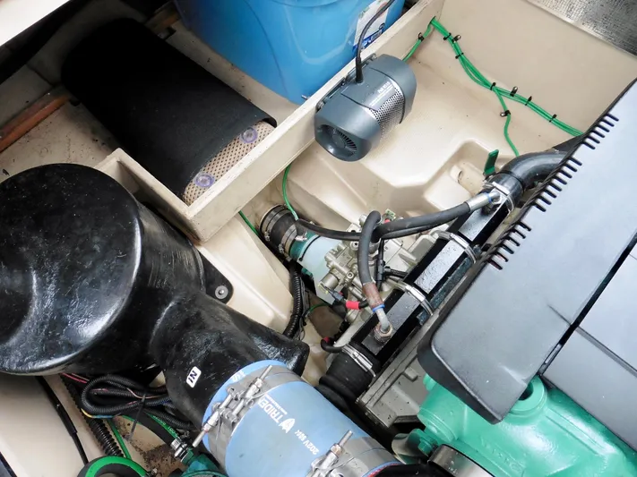  Yacht Photos Pics Engine compartment of a 2015 Cutwater 30CB boat, showcasing mechanical components and wiring.