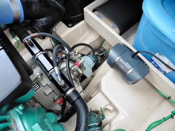  Yacht Photos Pics Engine compartment of a 2015 Cutwater 30CB boat, featuring various mechanical components.