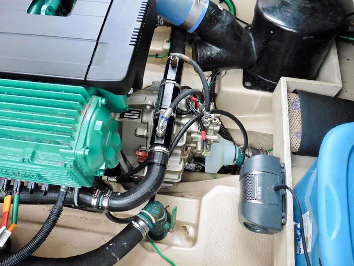  Yacht Photos Pics Engine compartment of a 2015 Cutwater 30CB boat, showcasing mechanical components.