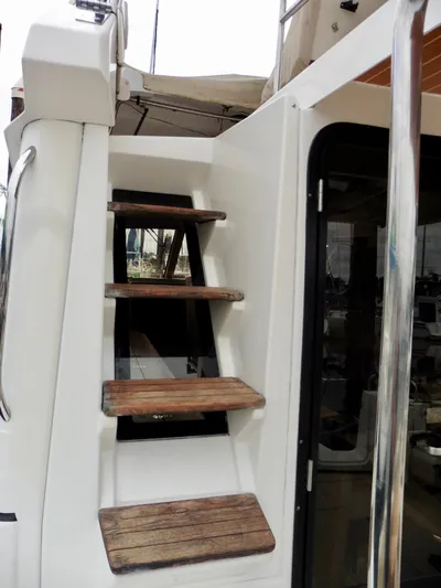  Yacht Photos Pics Staircase on 2015 Cutwater 30CB boat, featuring wooden steps and sleek design.