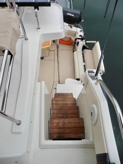  Yacht Photos Pics 2015 Cutwater 30CB boat interior with wooden steps and seating area.