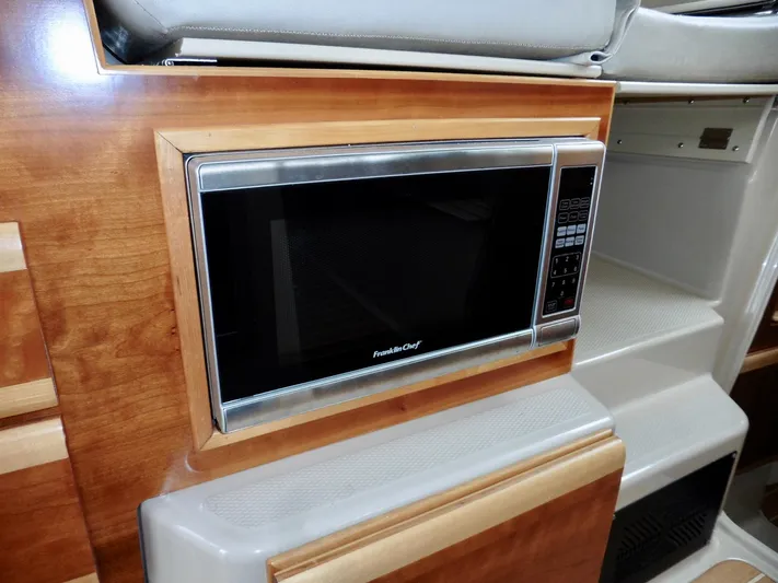  Yacht Photos Pics Built-in microwave in 2015 Cutwater 30CB boat interior.