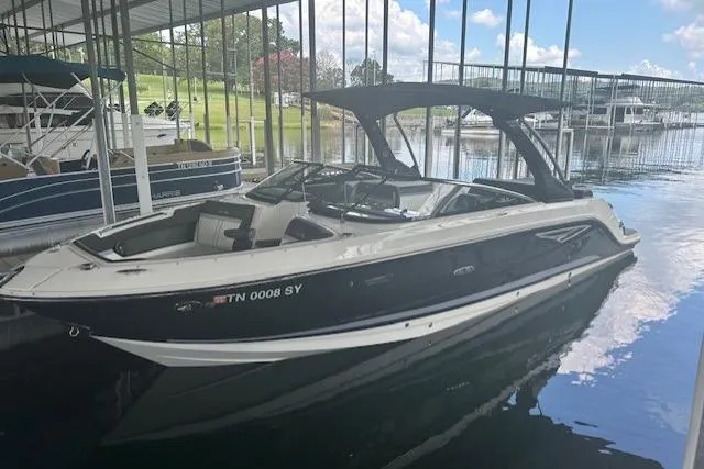  Yacht Photos Pics 2017 Sea Ray SLX 280 boat docked in a marina under a canopy.