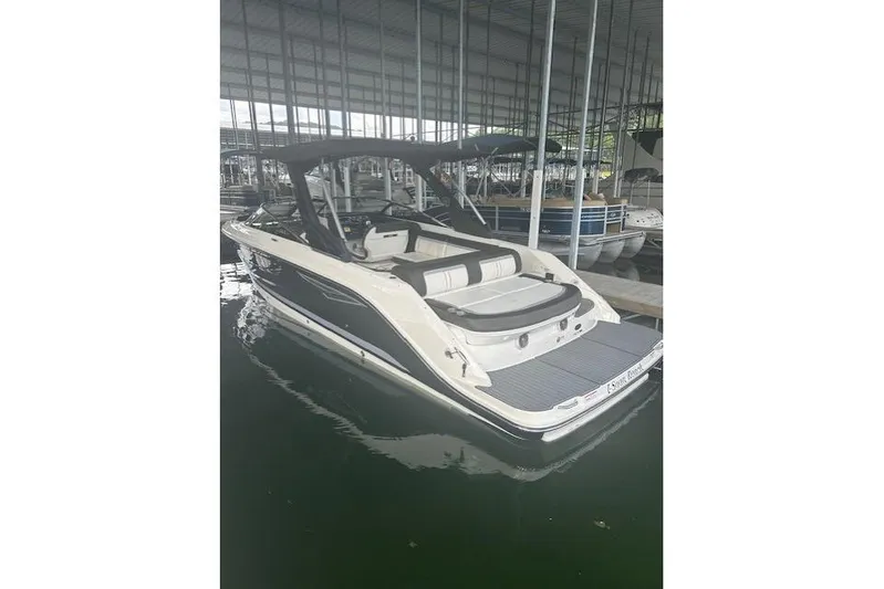  Yacht Photos Pics 2017 Sea Ray SLX 280 boat docked in a covered marina.