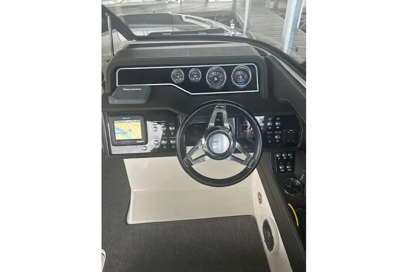  Yacht Photos Pics 2017 Sea Ray SLX 280 helm with steering wheel, gauges, and navigation display.