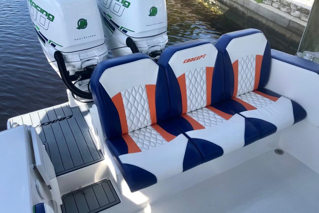 2020 Concept 36' Cuddy Cabin boat with custom seating and twin outboard engines.