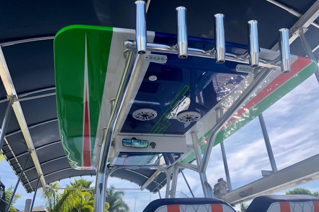 2020 Concept 36' Cuddy Cabin boat with colorful T-top and rod holders.