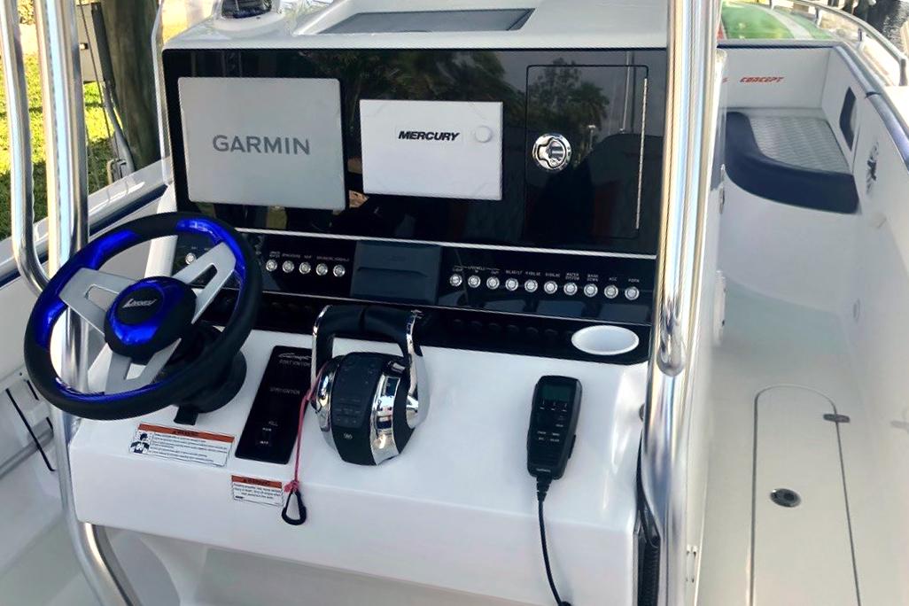 Control console of a 2020 Concept 36' Cuddy Cabin boat with Garmin and Mercury systems.