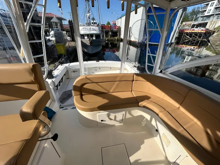  Yacht Photos Pics 1999 Carolina Classic 35 boat interior with tan seating at a marina.