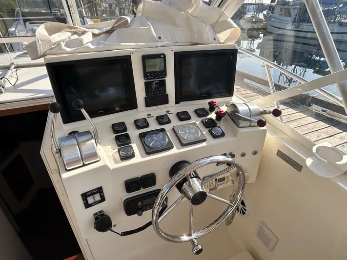  Yacht Photos Pics 1999 Carolina Classic 35 boat helm with dual screens and navigation controls.