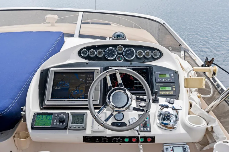 Persistence Yacht Photos Pics Cockpit of 2006 Sunseeker 75 Yacht with navigation instruments and steering wheel.
