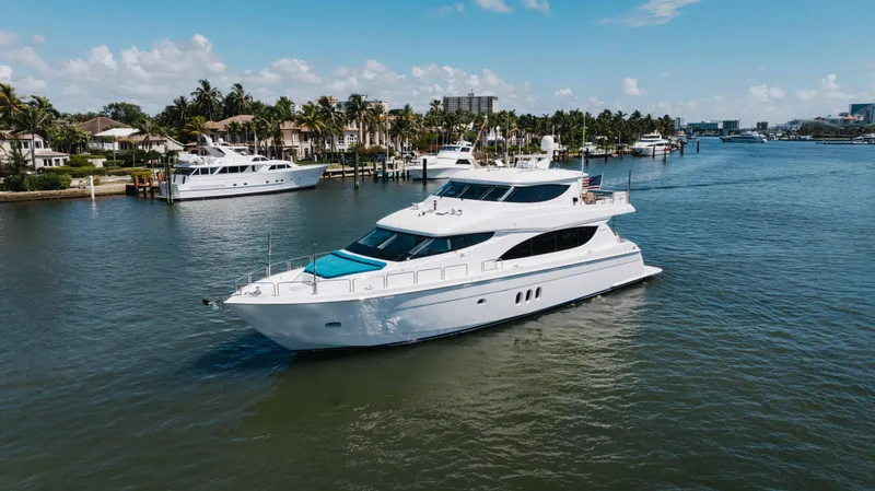 Ritz Sea Yacht Photos Pics 2014 Hatteras 80 Motor Yacht Sky Lounge cruising in a scenic waterfront setting.